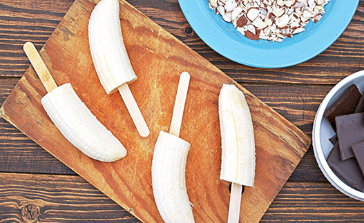 Frozen Banana Pops on a cutting board