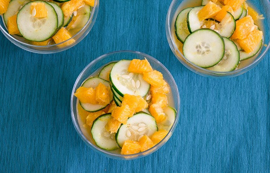 cucumber and orange salad in a bowl