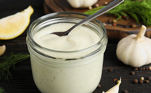 a jar of creamy italian herb dressing
