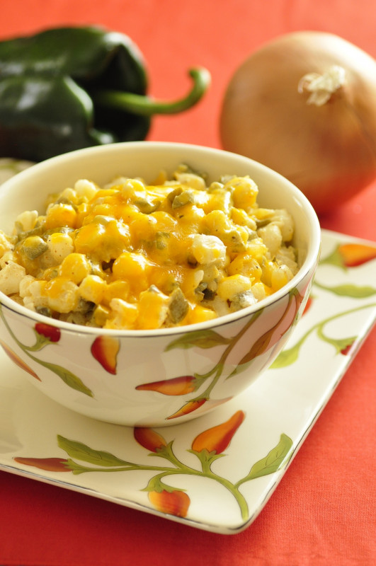 Bowl of chili cheese hominy