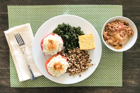 image of a plate of food containing beans and rice and some other foods